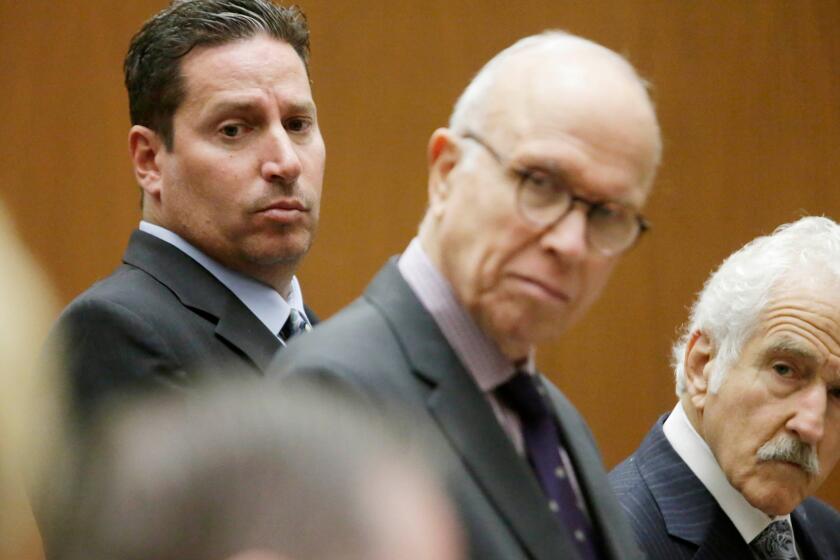 Todd DeStefano, a former executive at the Los Angeles Memorial Coliseum, with by his attorneys Richard Hirsch, center, and Michael Nasatir, right, was sentenced to six months in jail.