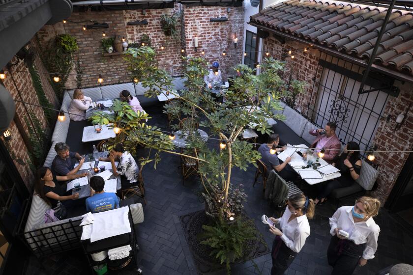 WESTWOOD, CA - JUNE 12: The courtyard is the most popular dining area at Violet. The Westwood restaurant and cooking school is preparing to reopen fully on June 15. Photographed on Saturday, June 12, 2021 in Westwood, CA. (Myung J. Chun / Los Angeles Times)