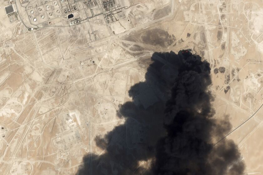 This Saturday, Sept. 14, 2019, satellite image from Planet Labs Inc. shows thick black smoke rising from Saudi Aramco's Abqaiq oil processing facility in Buqyaq, Saudi Arabia. Yemen's Houthi rebels launched drone attacks on the world's largest oil processing facility in Saudi Arabia and a major oil field Saturday, sparking huge fires and halting about half of the supplies from the world's largest exporter of oil. (Planet Labs Inc via AP)