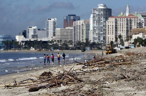 The sun made an appearance Tuesday afternoon, bringing visitors to Long Beach's Junipero Beach, where washed-up debris was evidence of the recent storm.