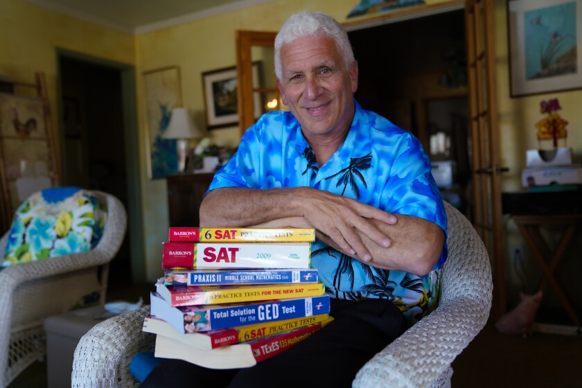 Author Steve Reiss is shown with some of the test-prep books he has written, co-written and/or edited.  