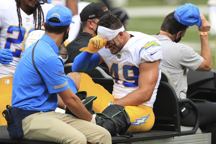 Los Angeles Chargers linebacker Drue Tranquill (49) is carted off the field.