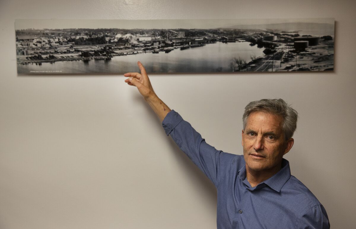 Mayor Bill Brand points to a photo of the AES power plant site in Redondo Beach in 1908, when much of it was wetlands.
