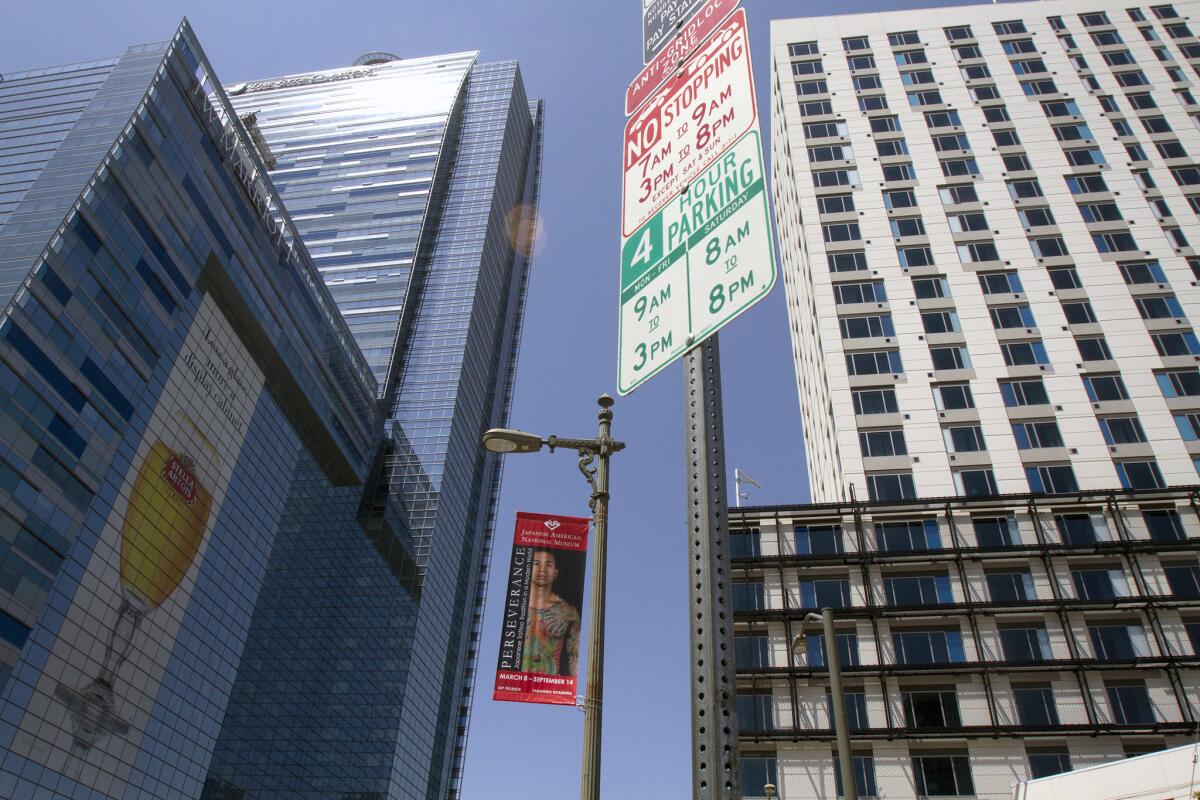 The Marriott Courtyard and Marriott Residence Inn on the right stand next to the JW Marriott hotel across from L.A. Live. The Courtyard and Residence Inn will be among the first in the Marriott family to accept Apple Pay.
