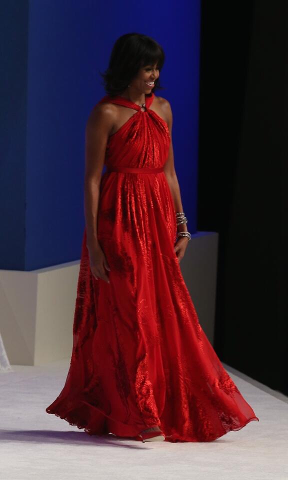 First lady Michelle Obama in a Jason Wu gown, walks on stage during the Commander in Chief Inaugural Ball at the Walter E. Washington Convention Center on January 21, 2013 in Washington, DC.