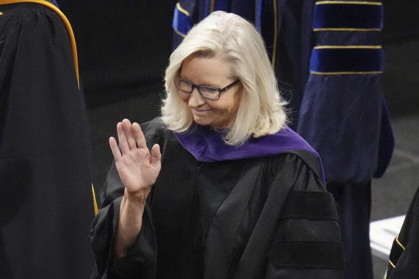 Former U.S Rep. Liz Cheney, R-Wyo., waves before delivering the commencement address at Colorado College, Sunday, May 28, 2023, in Colorado Springs, Colo. (AP Photo/Jack Dempsey)