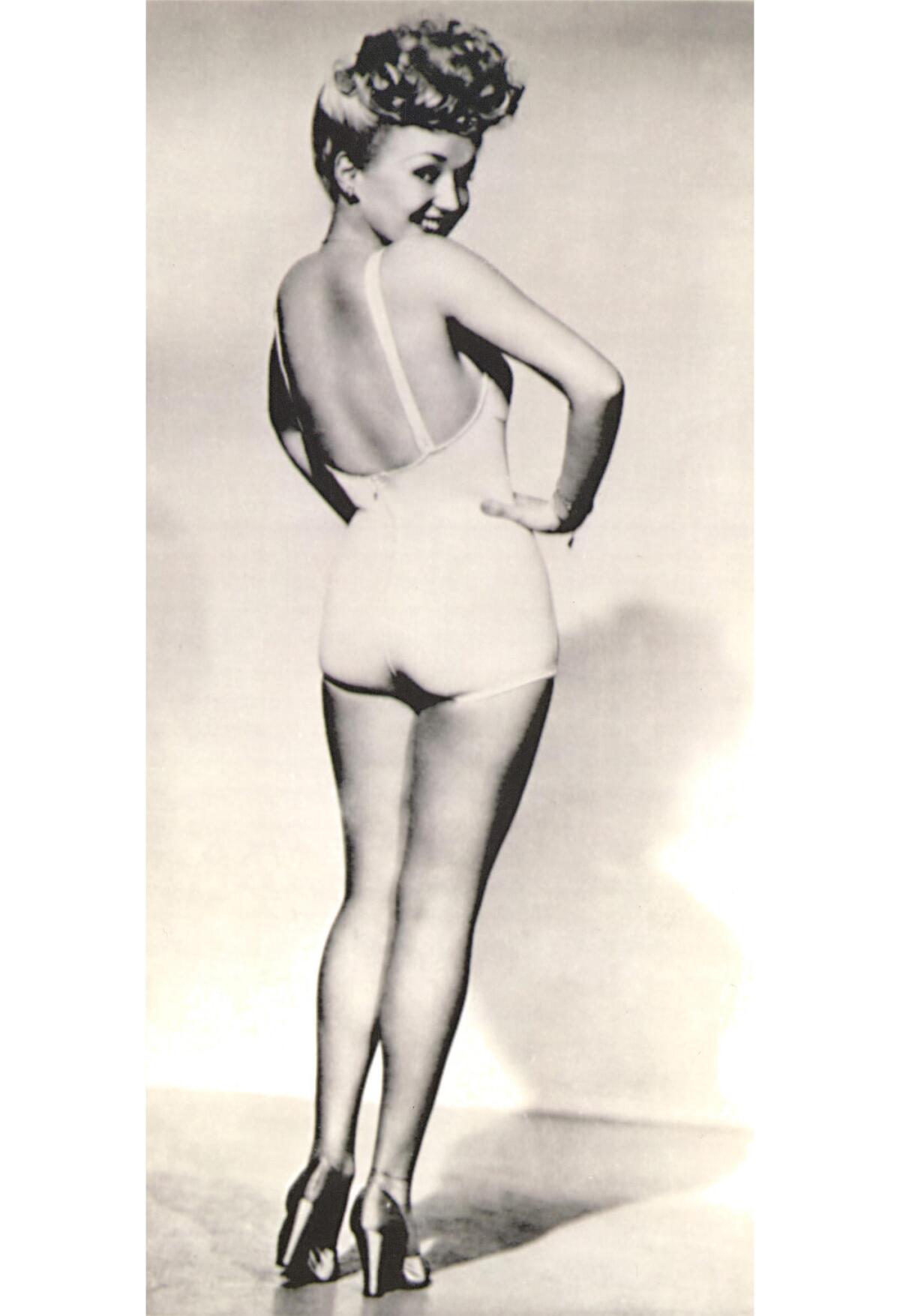 Actress, singer and dancer Betty Grable poses for a pinup photo that made her a favorite with U.S. troops during World War II. Her legs were insured for $1 million as a publicity stunt.