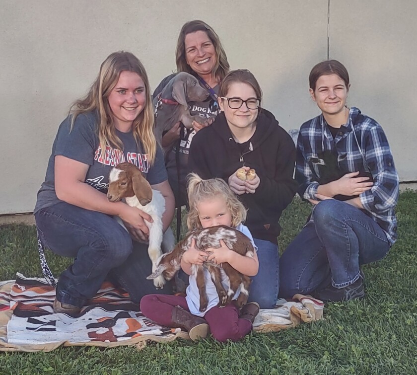 The fundraising volunteers are, from left, Morgan Nelson, Stacey Gill, Hope Ash and Abigail Ash, with Lily Ash in front.