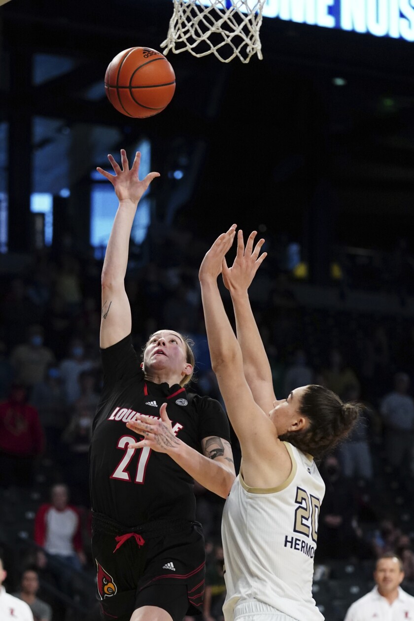 Louisville forward Emily Engstler (21) goes up for the winning basket as Georgia Tech center Nerea Hermosa (20) defends in the final seconds of an NCAA college basketball game Sunday, Jan. 2, 2022, in Atlanta. (AP Photo/John Bazemore)