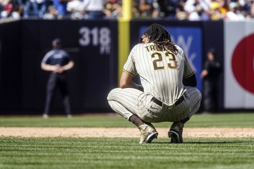 San Diego Padres Fernando Tatis Jr. kneels on the field after grounding out to third during the tenth inning of a baseball game against the New York Yankees, Saturday, May 27, 2023, in New York. (AP Photo/Bebeto Matthews)