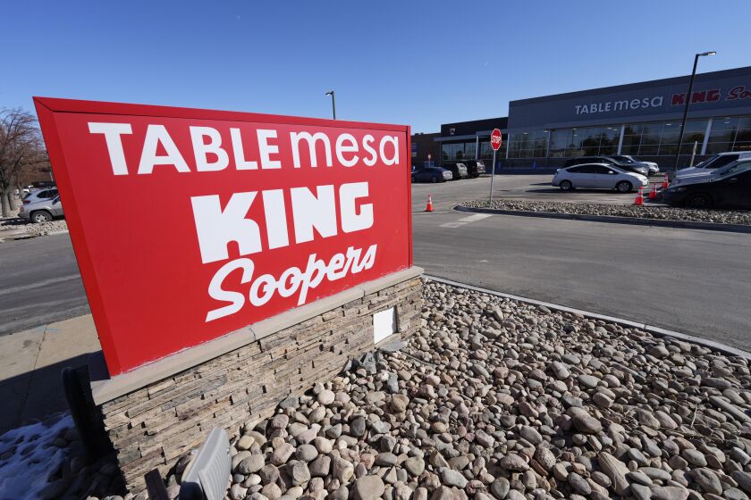 The new sign is displayed outside the Table Mesa King Soopers during a media tour Tuesday, Feb. 8, 2022, in Boulder, Colo. Ten people were killed inside and outside the store when a gunman opened fire on March 22, 2021. The store reopens with new renovations on Wednesday, Feb. 9. (AP Photo/David Zalubowski)