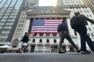 FILE - The American flag hangs from the front of the New York Stock Exchange on Sept. 10, 2024, in New York. (AP Photo/Peter Morgan, File)