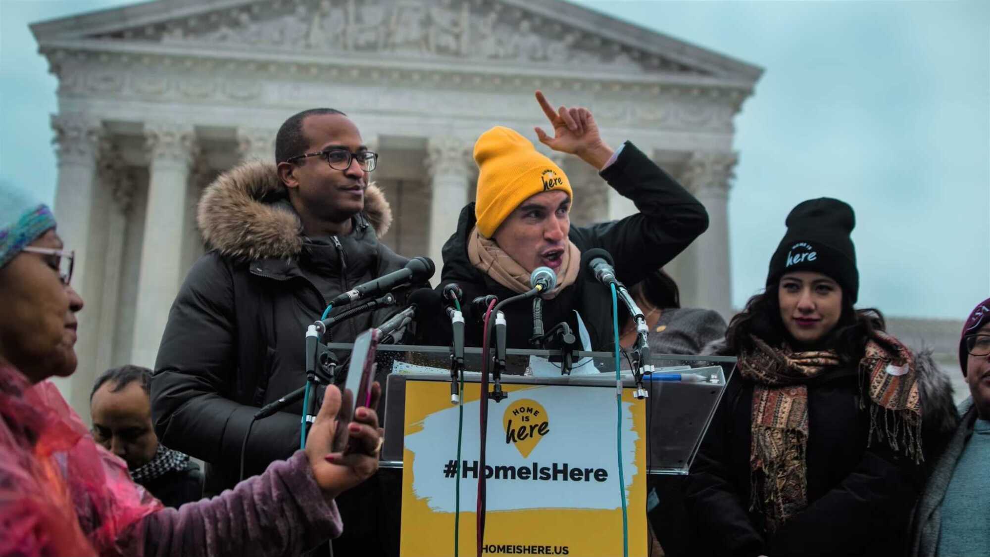 A man speaks at a podium