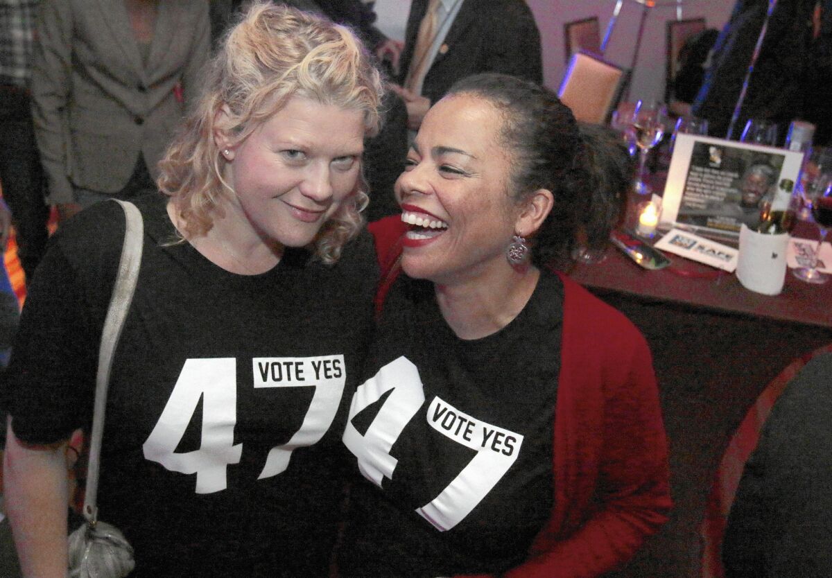 Donna Jo Thorndale, left, and Sabra Williams, both supporters of Proposition 47, celebrate as voters pass the measure.