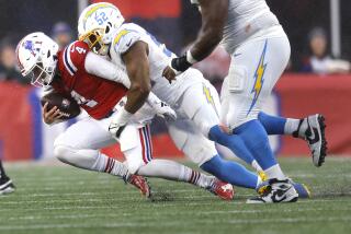 New England Patriots quarterback Bailey Zappe is sacked by Chargers linebacker Khalil Mack.