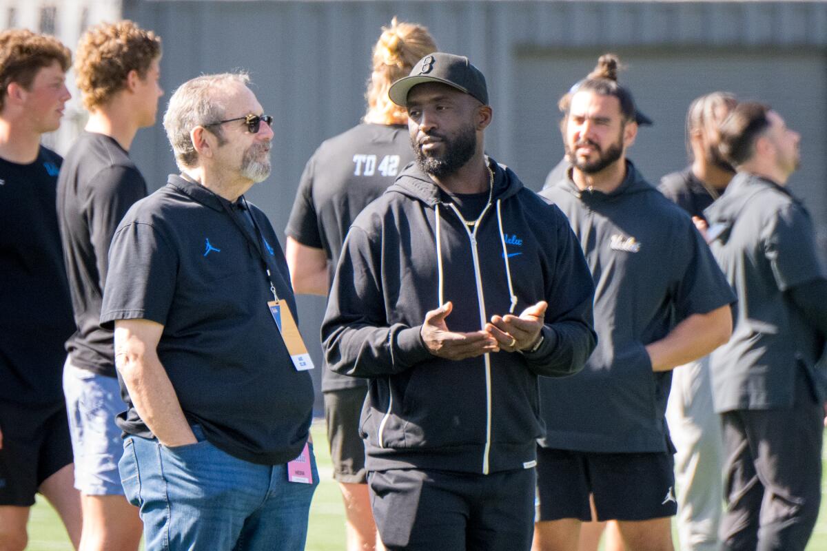 UCLA head coach DeShaun Foster talks on the sidelines during UCLA's pro day.