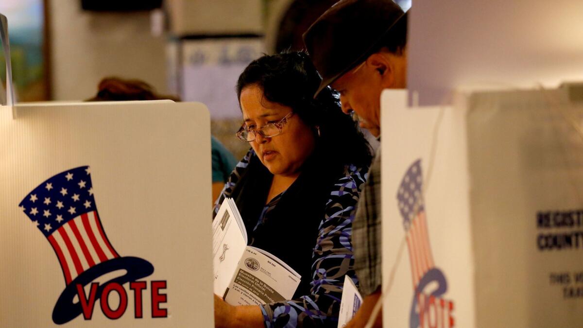 Jesus and Adriana Mata cast their ballots in the California primary election in Boyle Heights, a predominantly Latino area, on June 7, 2016. Latino voters have rarely turned out in numbers comparable to their share of the state's population.