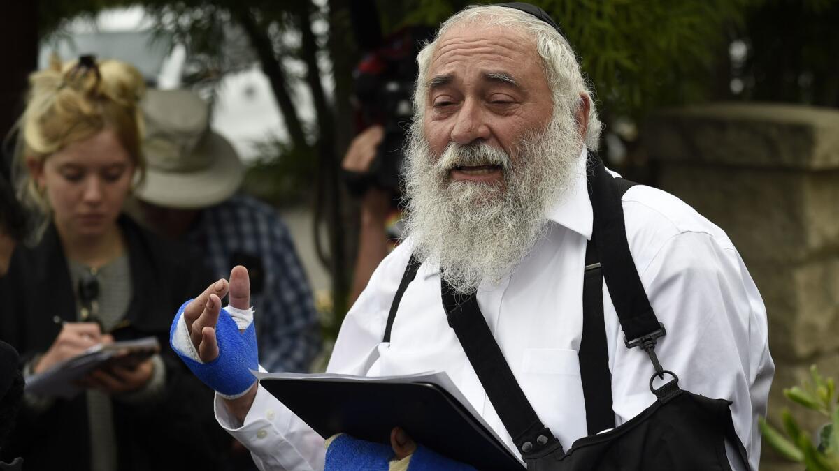 Rabbi Yisroel Goldstein speaks at a news conference Sunday.