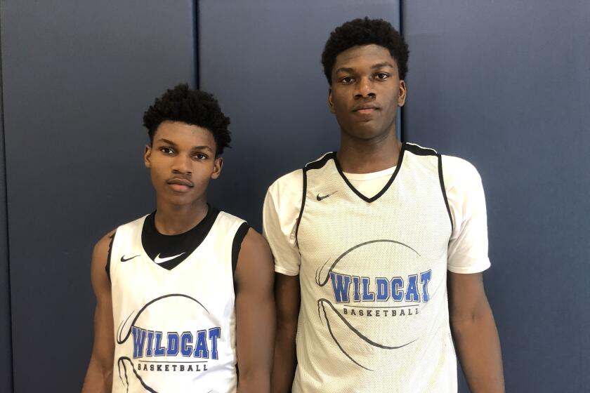 Sophomore point guard Dylan Andrews (left) and sophomore 6-foot-8 Kijani Wright figure to lead Windward to basketball prominence before they graduate.