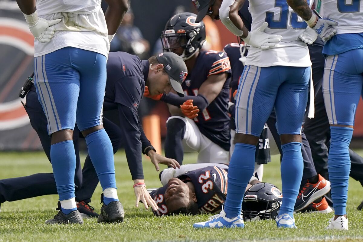 Chicago Bears running back David Montgomery grimaces in pain after being injured during the second half of an NFL football game against the Detroit Lions Sunday, Oct. 3, 2021, in Chicago. (AP Photo/Nam Y. Huh)
