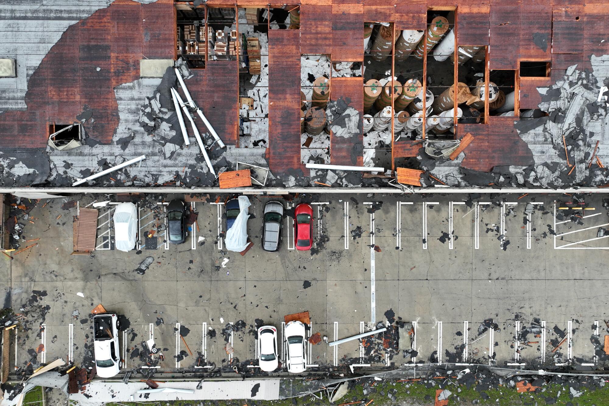 Aerial view of damaged building and debris 