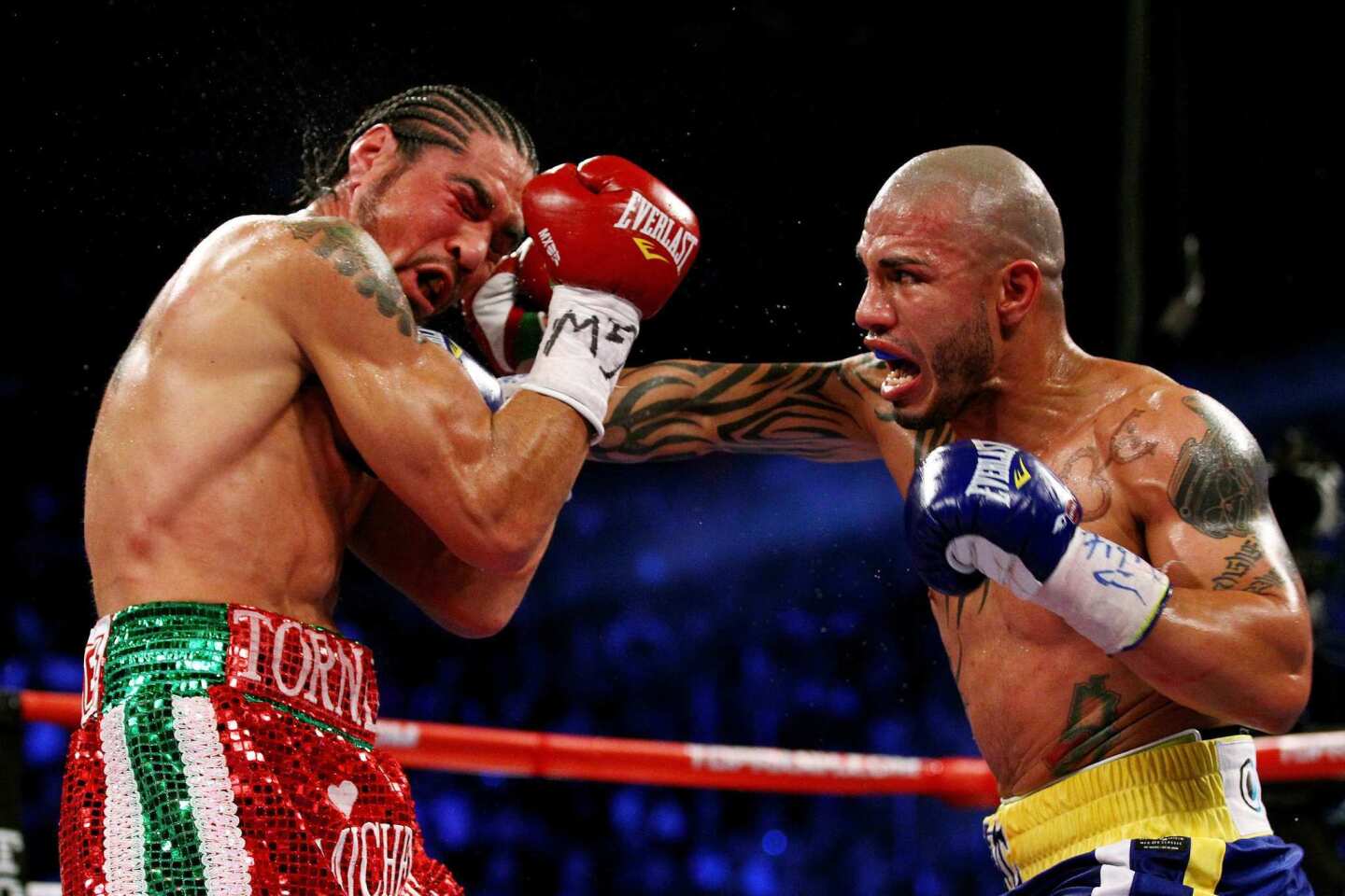 Miguel Cotto lands a hard right to the face of Antonio Margarito during their WBA junior-middleweight championship bout on Saturday night at Madison Square Garden in New York. Cotto, the defending champion, won by a ninth round technical knockout.