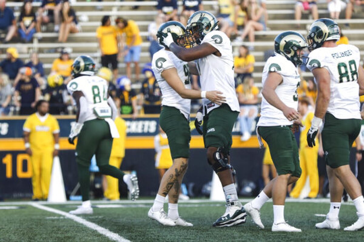 Colorado State's Cayden Camper, left, and Keith Williams celebrate Camper's field goal against Toledo during an NCAA college football game in Toledo, Ohio, Saturday, Sept. 18, 2021. (Rebecca Benson/The Blade via AP)
