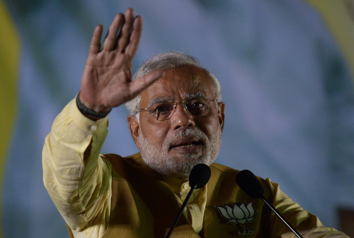 Narendra Modi, chief minister of India's western state of Gujarat and the main opposition Bharatiya Janata Party's candidate for prime minister, gestures as he speaks during a campaign rally in Kolkata.