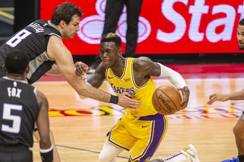 Los Angeles Lakers guard Dennis Schroder (17) drives to the basket as Sacramento Kings forward Nemanja Bjelica.