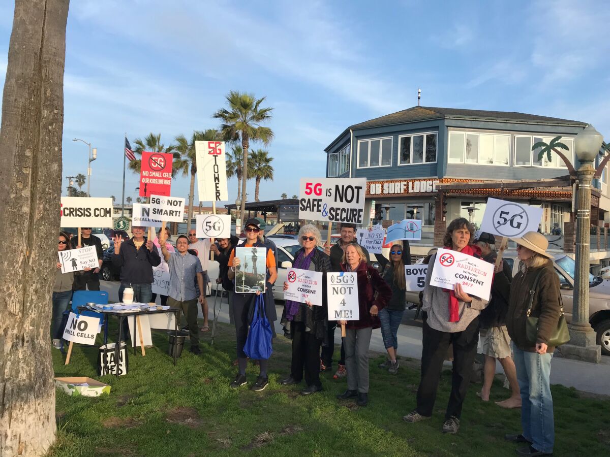 Citizens gather to protest 5G tower installations.