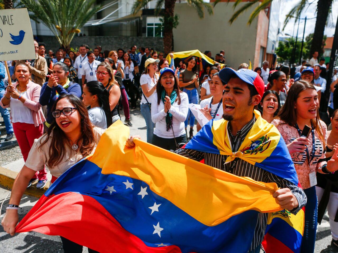 Venezuelan opposition protesters participate in a demonstration to demand the end of the crisis and in support of the interim presidency of Juan Guaido, in Caracas.