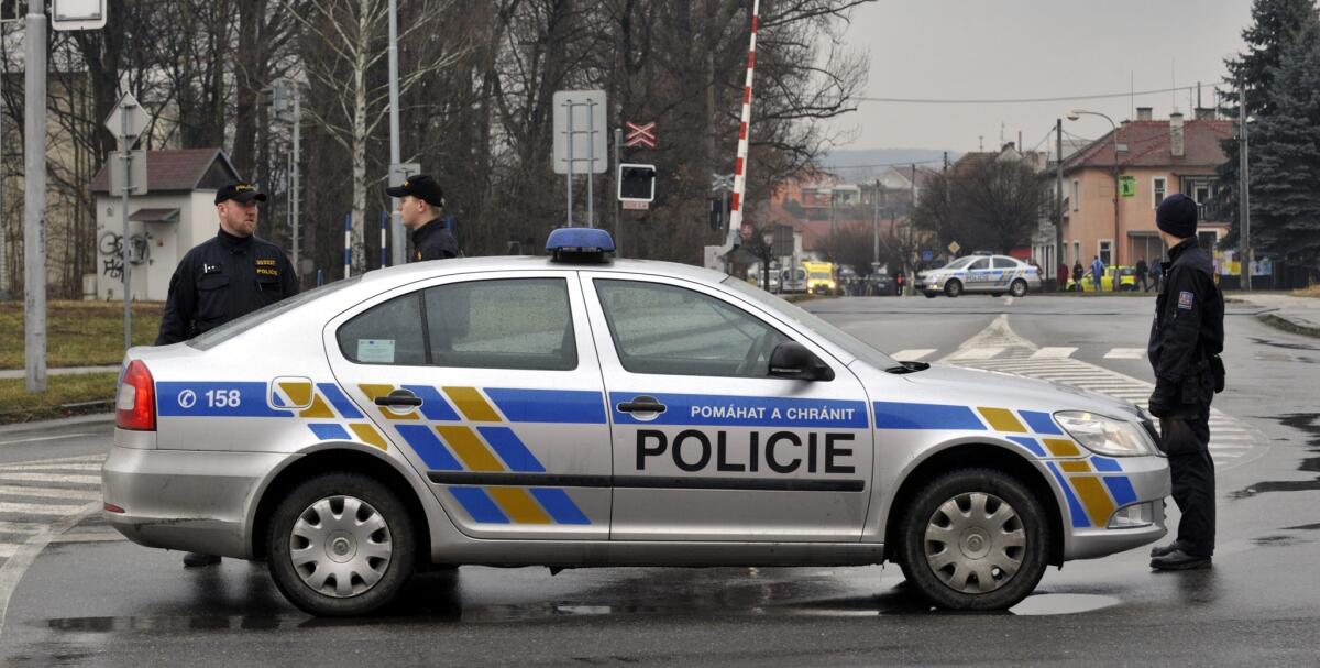 A police car blocks a street near a restaurant where a gunman opened fire Feb. 24 in the Czech Republic town of Uhersky Brod.