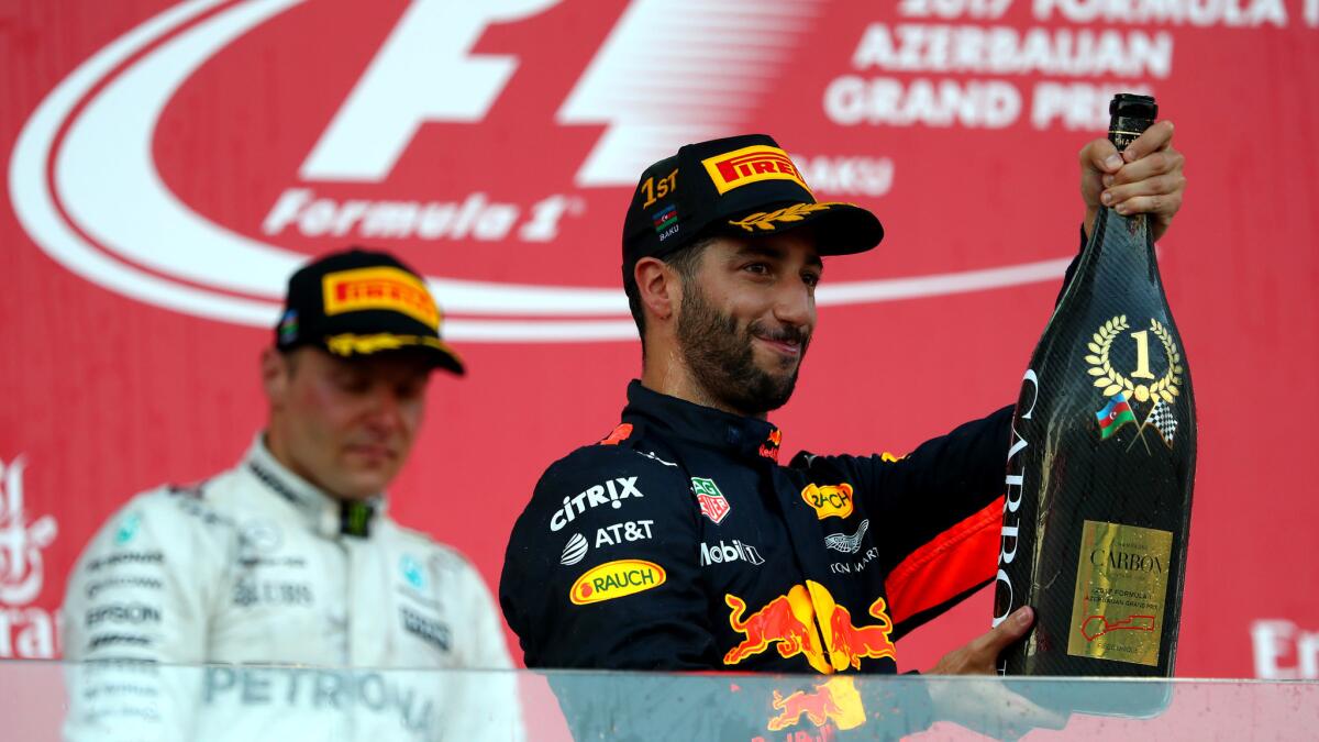 Formula One driver Daniel Ricciardo celebrates on the podium after winning the Azerbaijan Grand Prix on SUnday.