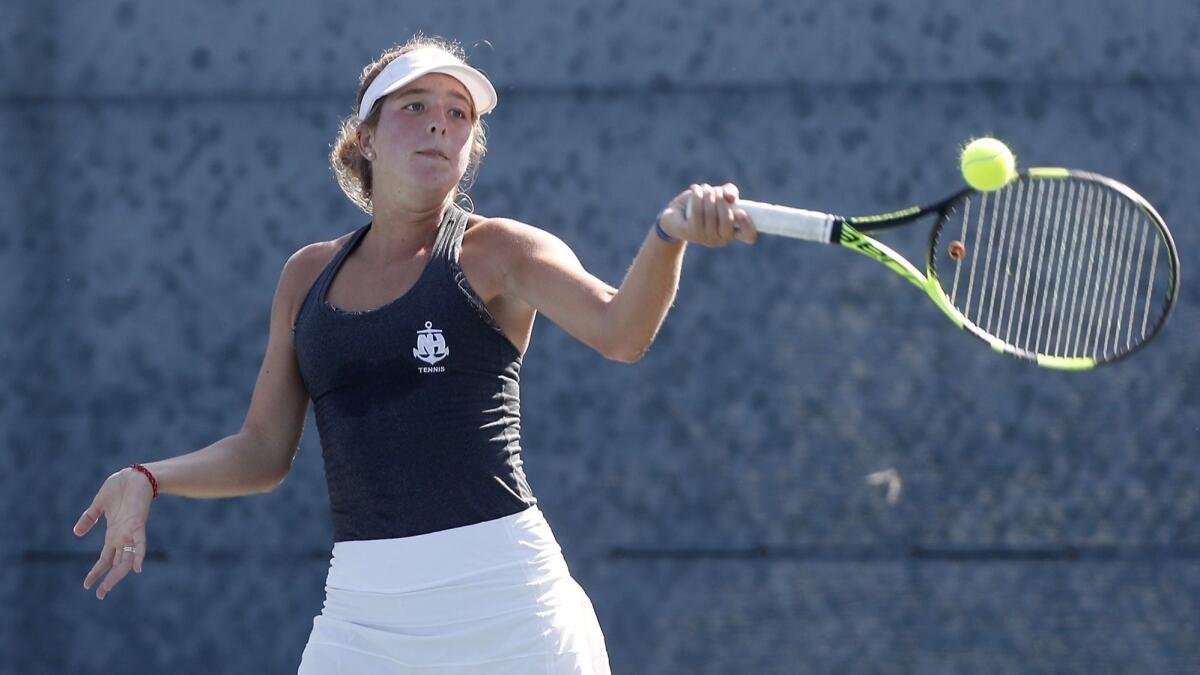 Newport Harbor High singles player Lane McArdell, the No. 2 seed, competes in a Surf League semifinal match at Seal Beach Tennis Center on Thursday.