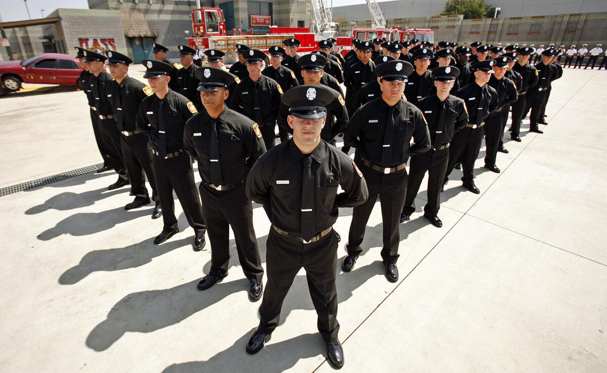 There were no women in the class of Los Angeles Fire Department recruits that graduated on June 12, 2014, above. And in the next training class, all four women recruits have been eliminated.