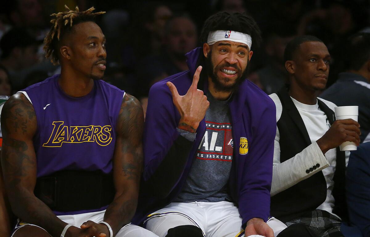 Veteran centers Dwight Howard, left, and JaVale McGee are having an enjoyable time with the Lakers this season.