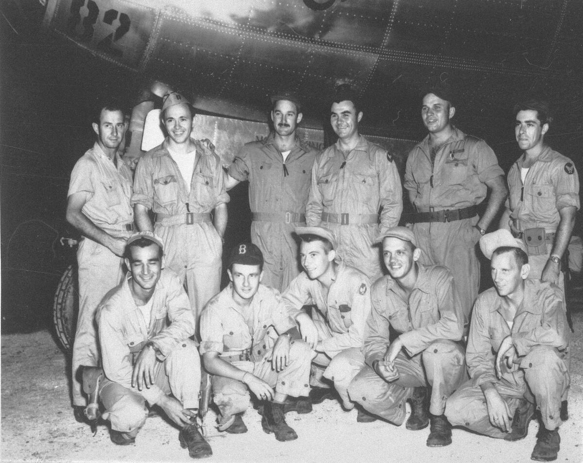 In an undated photograph, Theodore Dutch Van Kirk, second from left in top row, stands with the flight crew who dropped a bomb code-named Little Boy on Hiroshima. Years later, Van Kirk told an interviewer, Do I regret what we did that day? No sir, I do not.