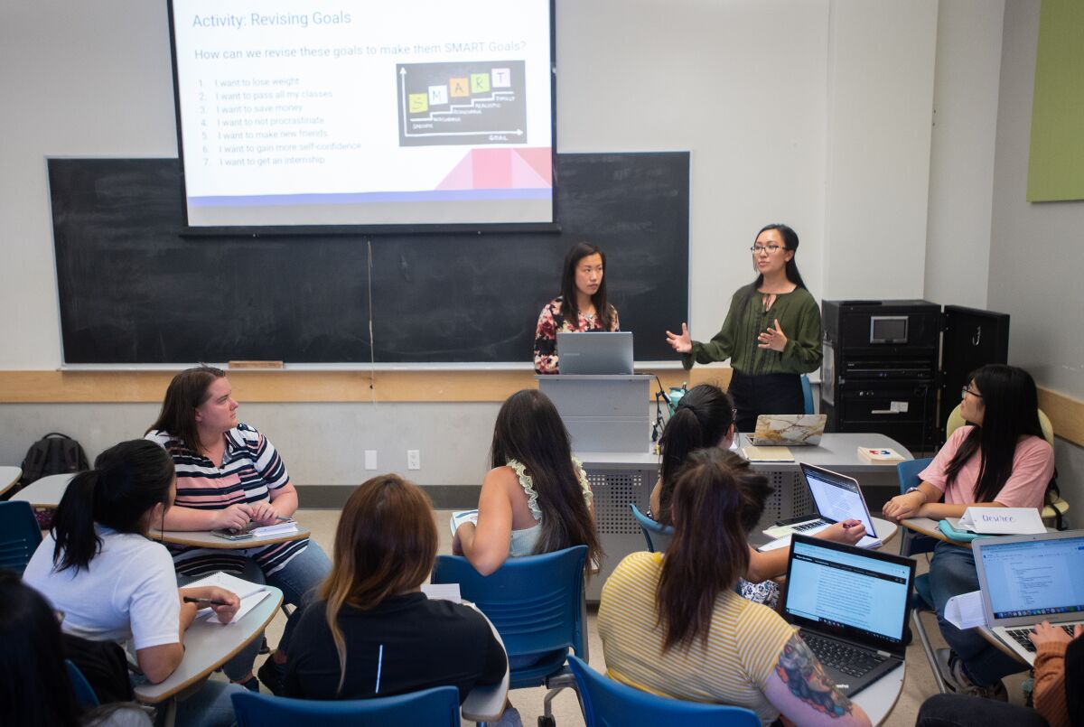 UC Berkeley students Belle Lau, left, and Jenny Zhou teach an "adulting" class for their peers.