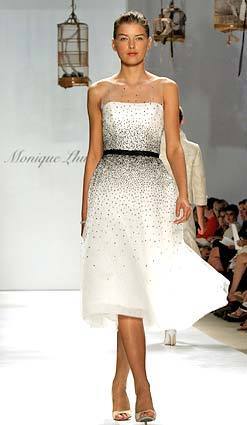 A caviar tulle bateau ballerina cocktail dress is modeled during the presentation of the spring/summer 2006 collection of Monique Lhuillier.