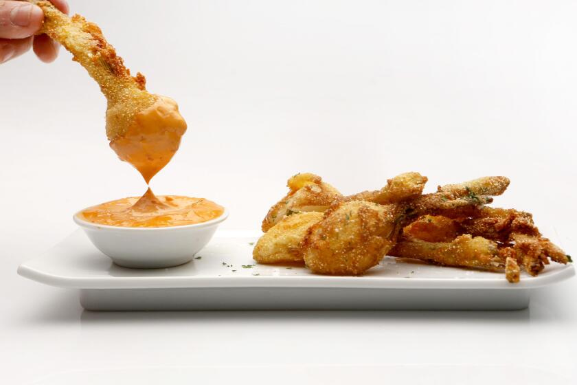 Cornmeal-fried spring onion with chili aioli shot in the Los Angeles Times studio on Sept. 9, 2015.