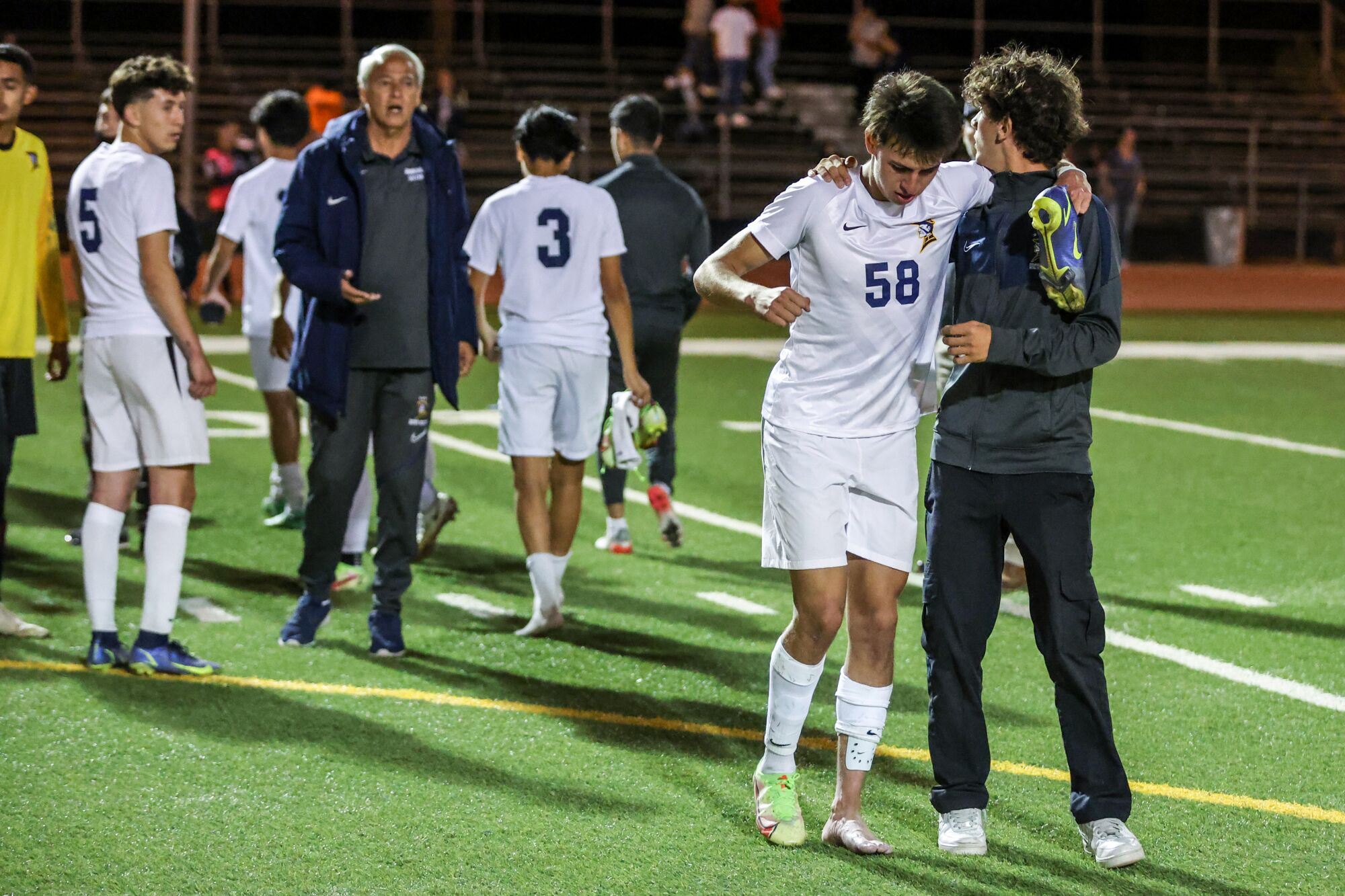 Birmingham's David Diaz is helped off the field after injuring his leg during a 3-1 loss to El Camino Real.