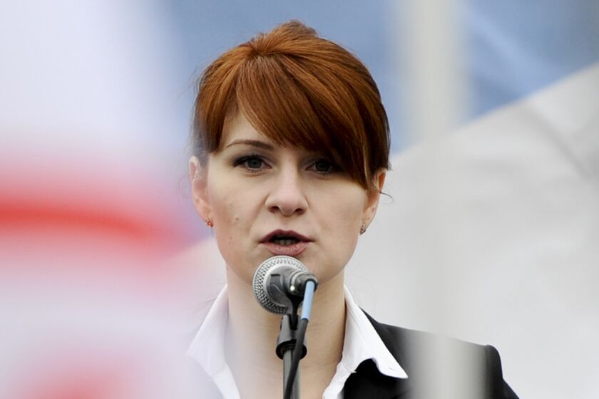 FILE - In this April 21, 2013 file photo, Maria Butina, leader of a pro-gun organization in Russia, speaks to a crowd during a rally in support of legalizing the possession of handguns in Moscow, Russia. Prosecutors say they have resolved a case against Butina accused of being a secret agent for the Russian government, a sign that she likely has taken a plea deal. The information was included in a court filing Monday. (AP Photo/File)