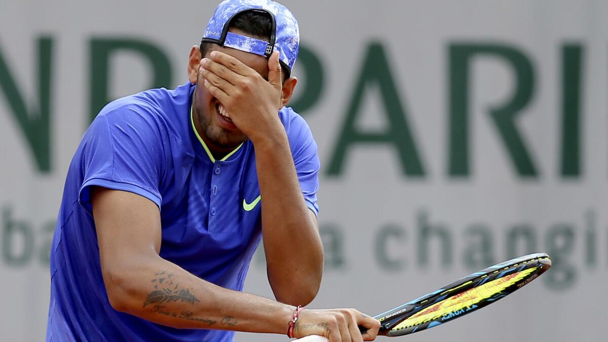 Nick Kyrgios reacts after missing a shot against Kevin Anderson during their second-round match at the French Open on Thursday.