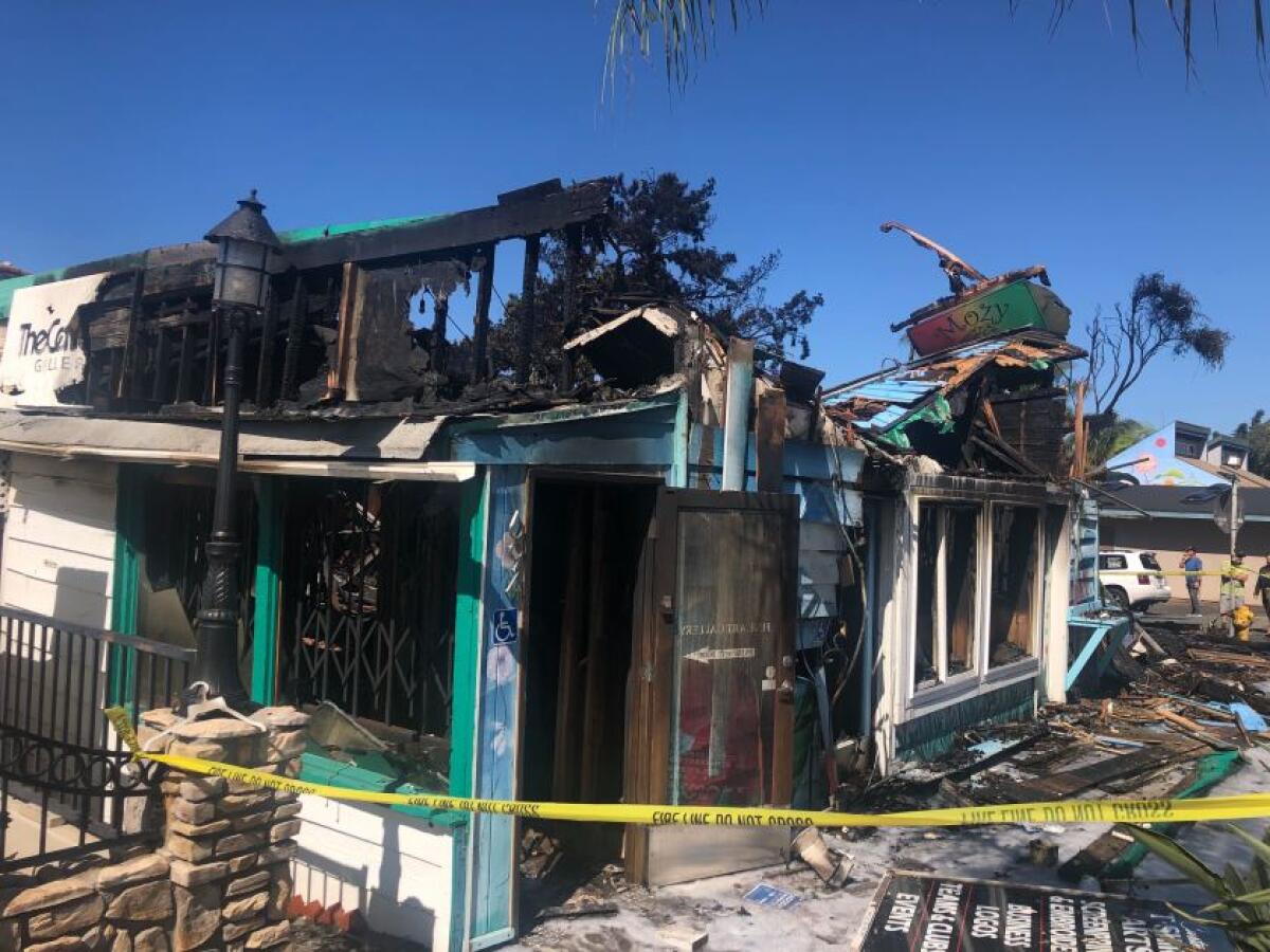 Firefighters worked for hours putting out a stubborn blaze that destroyed the iconic Mozy Cafe in Leucadia and three other businesses in the same building on Monday. A neighbor called 911 to report the fire shortly after midnight.
