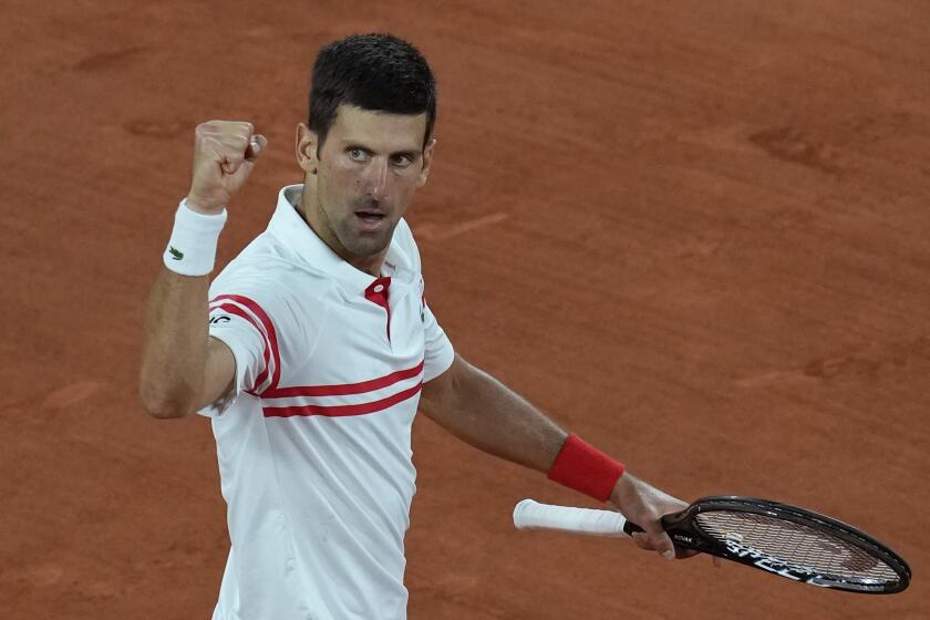 Serbia's Novak Djokovic celebrates winning a game against Spain's Rafael Nadal during their semifinal match.