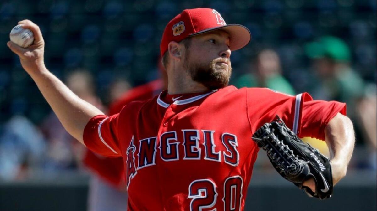 Angels pitcher Bud Norris throws against the Athletics during the first inning of a spring training game on Feb. 26.