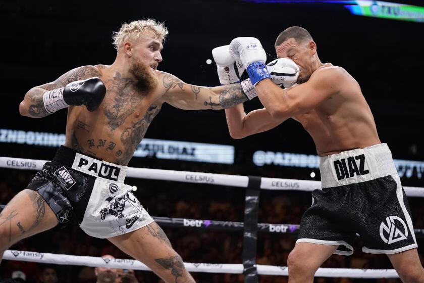 DALLAS, TEXAS - AUGUST 05: Jake Paul throws a left at Nate Diaz during the first round of their fight at the American Airlines Center on August 05, 2023 in Dallas, Texas. (Photo by Sam Hodde/Getty Images)
