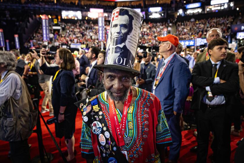 Milwaukee, WI - July 17: Alvin Porter Jr. of South Carolina wears a Lincoln top hat that he made along with his dashiki at the 2024 Republican National Convention on Wednesday, July 17, 2024 in Milwaukee, WI. (Jason Armond / Los Angeles Times)