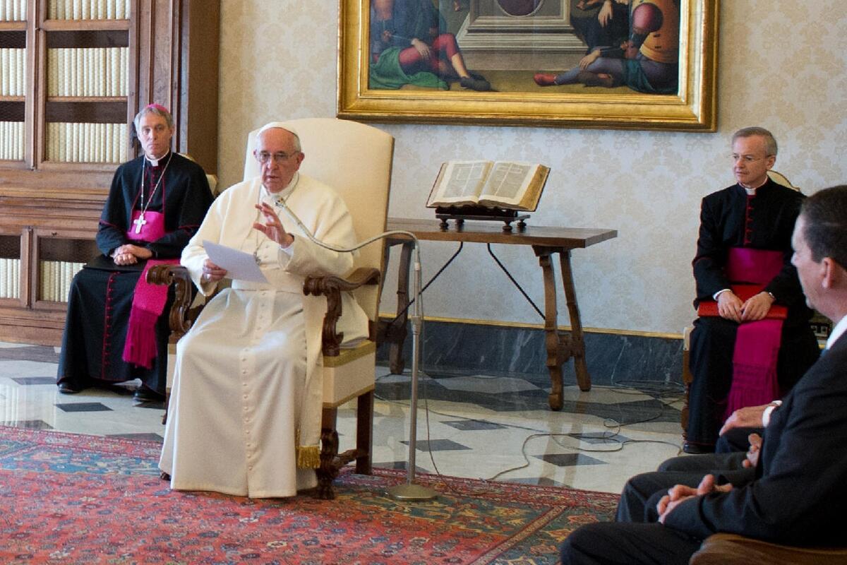 Pope Francis speaks with a delegation from the International Catholic Child Bureau at the Vatican on Friday.