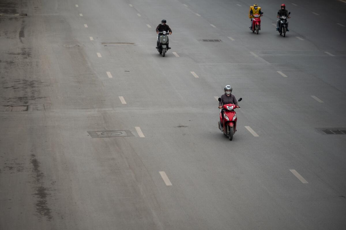 Traffic was light in Hanoi on Wednesday, the first day of Vietnam's two-week nationwide shutdown to stop the spread of the coronavirus.